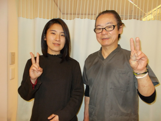 微笑み顔の院長と女性のお客様